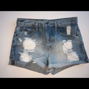 Distressed denim shorts.