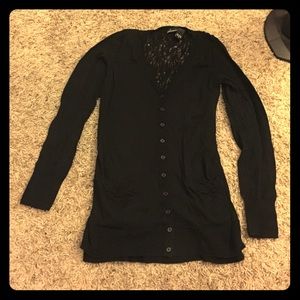 Black cardigan with detailed back.