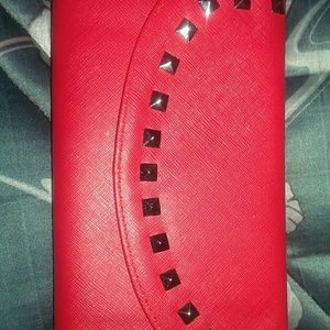 Red studded clutch