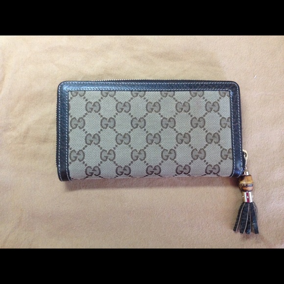 Gucci Zip around canvas wallet; tassel & bamboo