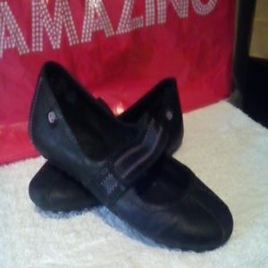 Black and purple slip on shoes with Velcro strap