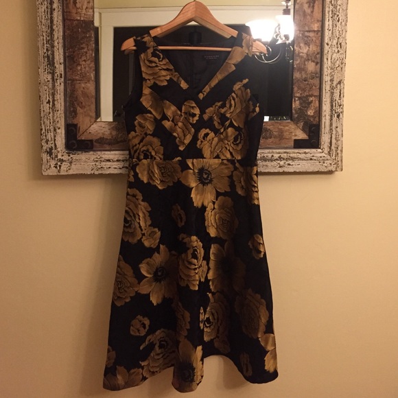 Back and gold dress