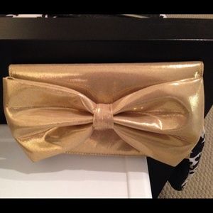 Brand new gold bow clutch