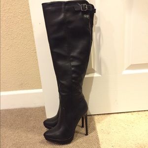 Brand new knee high black boots. *just fab*