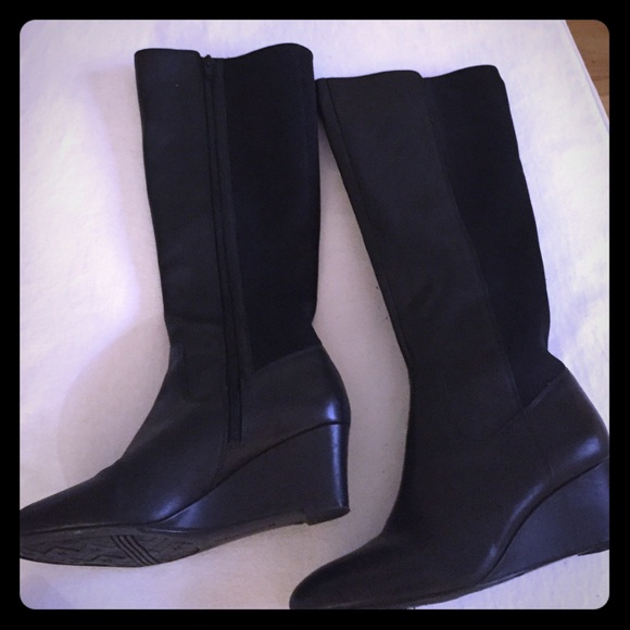 Tall black leather and fabric boots.