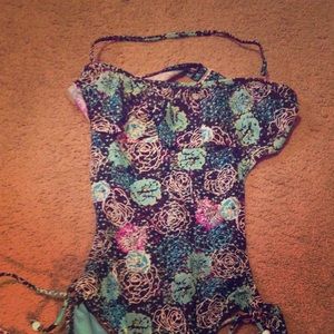 Swim suit with open back.