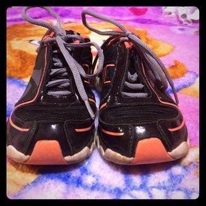Kids Blank and orange Reebok shoes