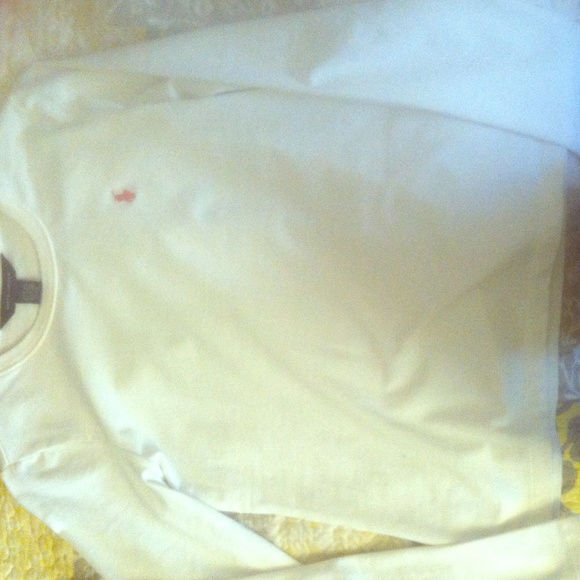 White polo , polo logo is pink,