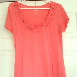 Coral summer teeshirt with embellished neckline.