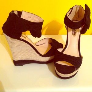Black bow wedge heels