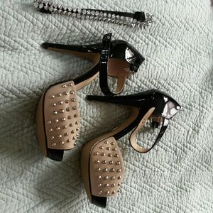 Black and nude spiked heels
