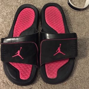 Pink and black Jordan sandals