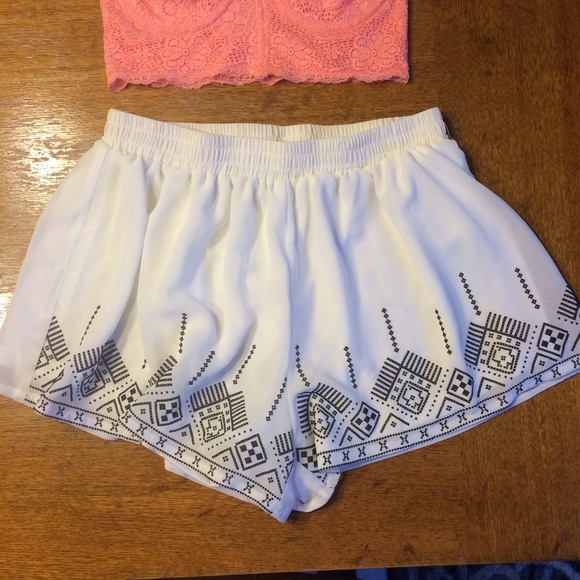 White shorts with print on bottom front trim
