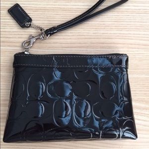 Shiny black Coach wristlet