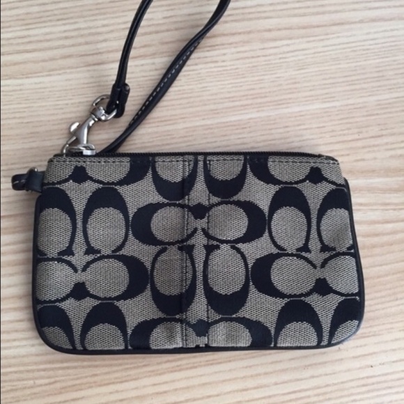 Black and grey Coach wristlet