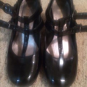 Black Mary Jane shoes.