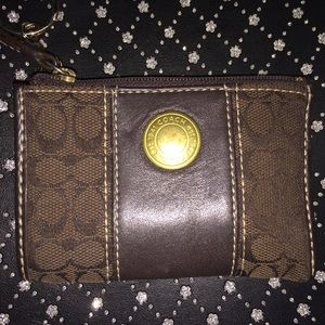 Dark brown Coach coin purse.