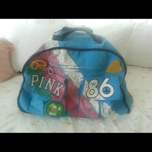 VS PINK rolling duffel bag.