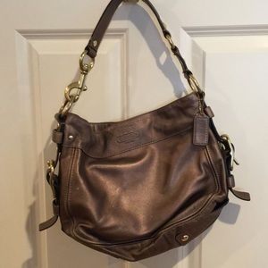 Coach purse bronze metallic with brass accents.