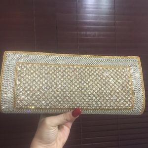 Gold evening clutch with rhinestones