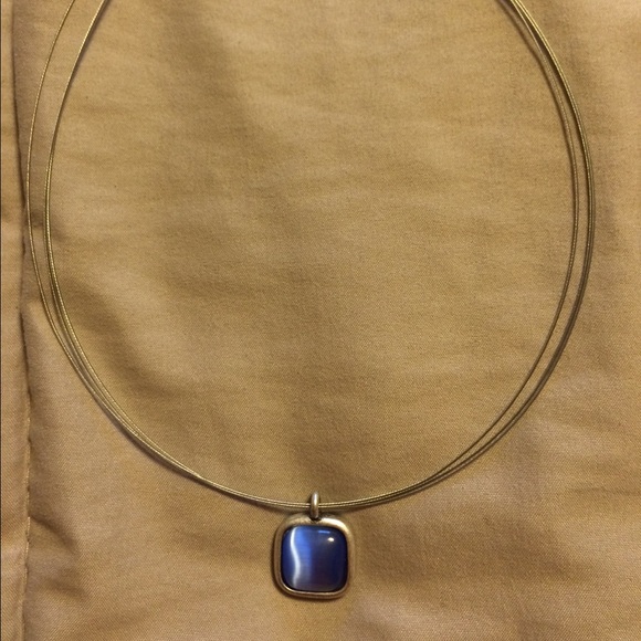 Silver structure necklace with blue stone