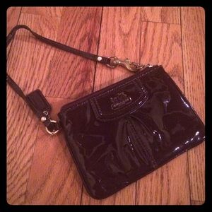 Dark purple patent coach wristlet