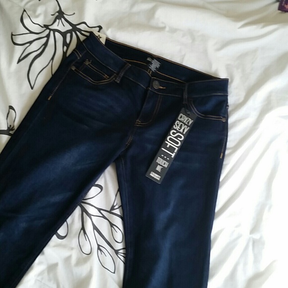 A pair of dark washed blue jeans