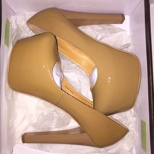 Bebe tan platform pumps