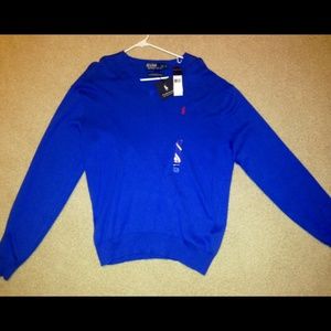 blue V-neck polo sweater