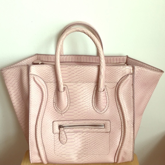 Pink snake skin bag.