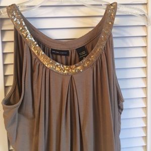 Beige top with gold sequence.