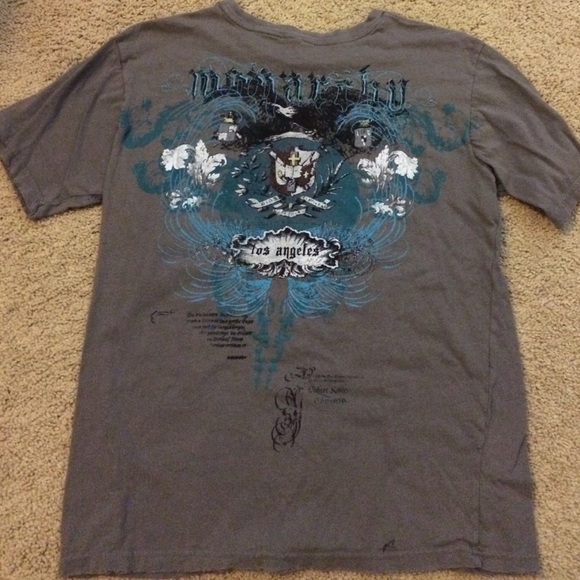 Grey black and blue Monarchy t shirt.