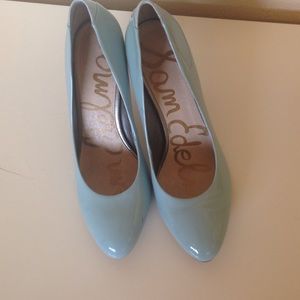 Baby blue patent leather pumps
