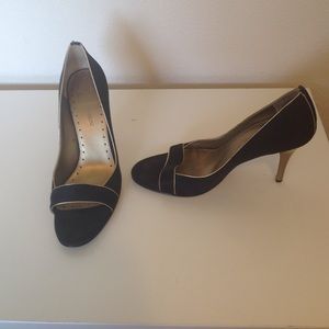 Black shoes with gold heels