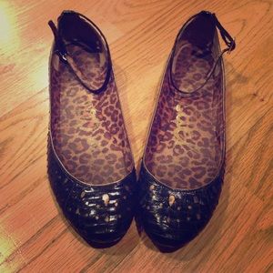 Black and gold leather ballet flats