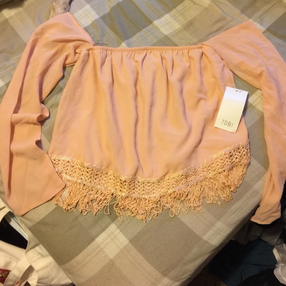 Pink off the shoulders top with ruffles. TOBI