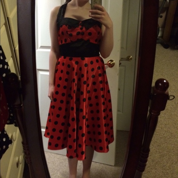 Red dress with black polka dots.