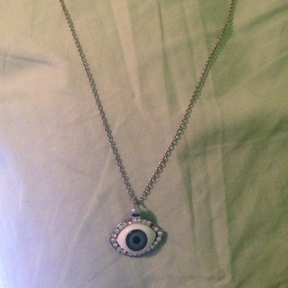 A silver green eye necklace