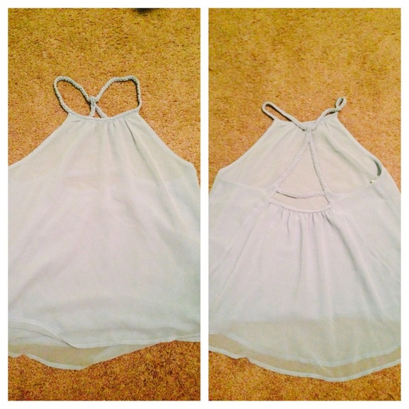 A blue open back shirt