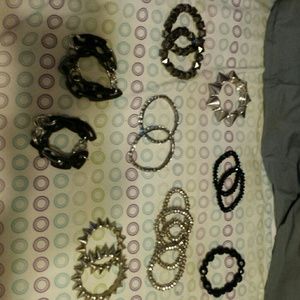 A 14 set of silver and black bracelets