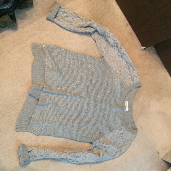 Sweater with lace detailing.