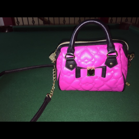 Cute pink Betsy Johnson mini shoulder bag.