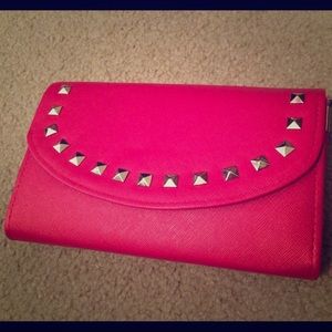 Dark pink purse with straps and carrying handle