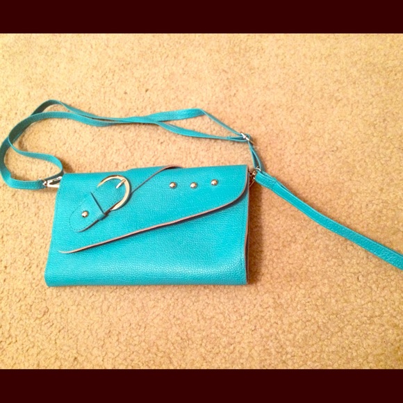 Turquoise purse with straps and carrying handle