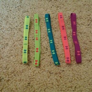 Five Under Armour youth headbands