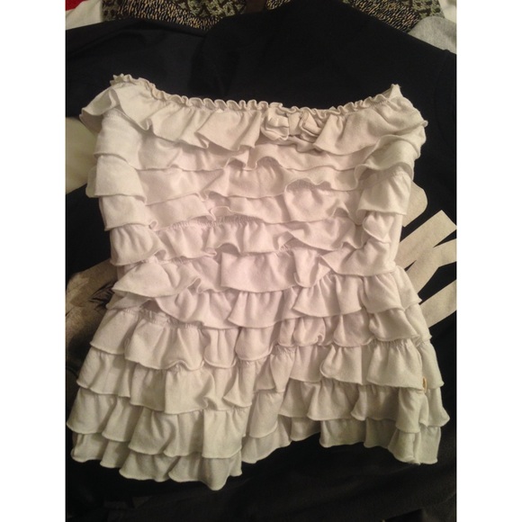 Sleeveless white crop top with ruffles