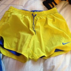 yellow & blue nike athletic shorts