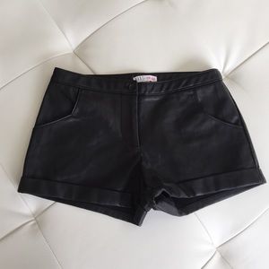 Black faux leather shorts