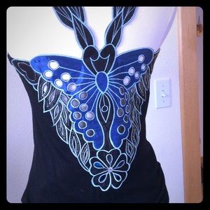 Black tank with butterfly goddess pattern on back.