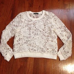 A white see-through pullover.